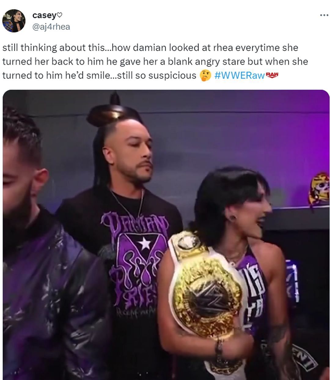 Damian Priest looking over Women's World Champion Rhea Ripley
